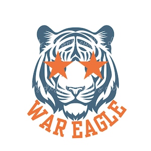 May include: A stylized tiger head design in navy blue and white, with orange star-shaped sunglasses. The text "WAR EAGLE" is in orange, arched below the tiger's face. This design is suitable for apparel and accessories.