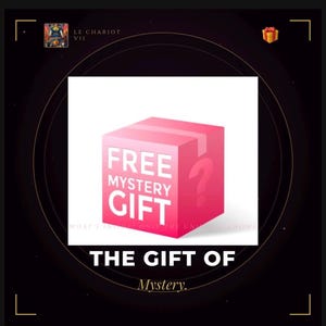 May include: A pink cube-shaped box featuring the white text FREE MYSTERY GIFT on the front face and a large white question mark on the side. The box is centered against a black background with the text THE GIFT OF Mystery. below the box.