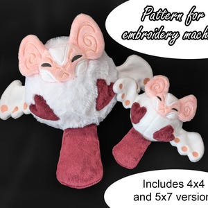May include: Embroidery pattern for a plush toy shaped like a bat with pink ears and wings, and a red body. The pattern includes 4x4 and 5x7 versions.