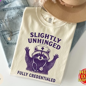 Comfort Colors® Funny Nurse Shirt, Slightly Unhinged Fully Credentialed Shirt,Nursing Tee Funny Raccoon Tee,Feral Nurse Shirt,Gift For Nurse