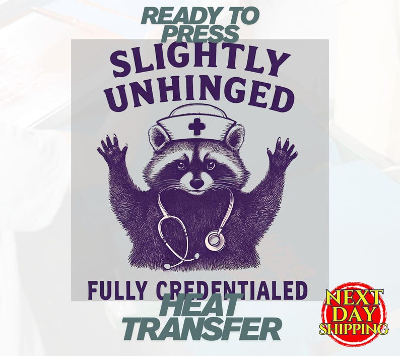 May include: A purple and white heat transfer design featuring a raccoon wearing a nurse's hat and stethoscope. The text reads "READY TO PRESS", "SLIGHTLY UNHINGED", "FULLY CREDENTIALED", and "HEAT TRANSFER". A "NEXT DAY SHIPPING" logo is also present.