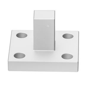 May include: A silver-colored metal base with a square platform and a rectangular vertical post. The platform has four evenly spaced, circular holes. The object is made of a solid, reflective material.