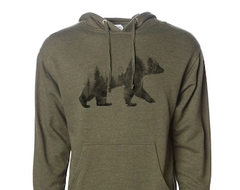 May include: A green hooded sweatshirt with a black silhouette of a bear with trees inside the bear's outline.
