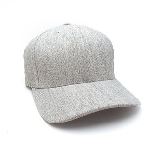 May include: A gray baseball cap with a structured crown and a curved brim. The cap is made of a textured fabric.