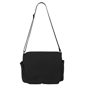 black crossbody messenger bag lifestyle angle canvas bag with nature graphic design
