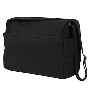 black messenger bag side view canvas shoulder bag with adjustable strap brass hardware