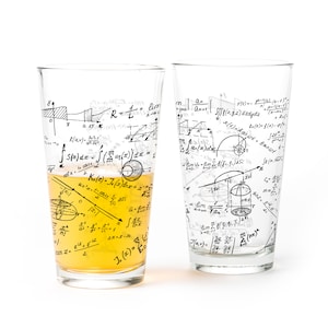 May include: Two clear pint glasses with black mathematical equations printed on them. One glass is partially filled with a yellow liquid. The equations include integrals, limits, and other mathematical symbols.