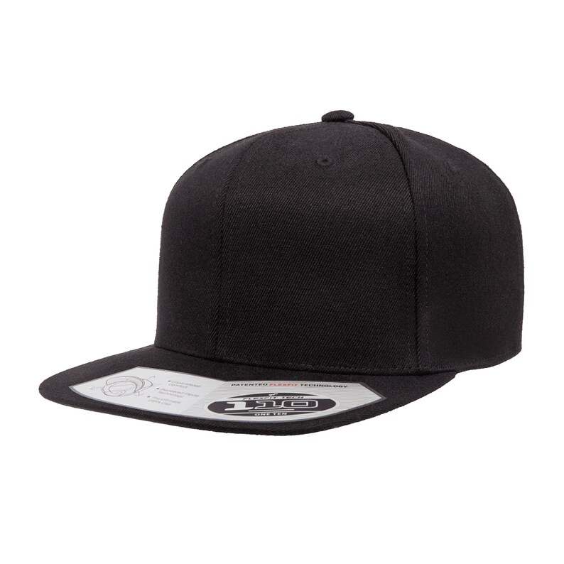 May include: A black, flat-brimmed baseball cap with a curved bill. The cap has a black, adjustable strap with a plastic buckle. The cap has a white label on the front that says "Flexfit" and "One Size".