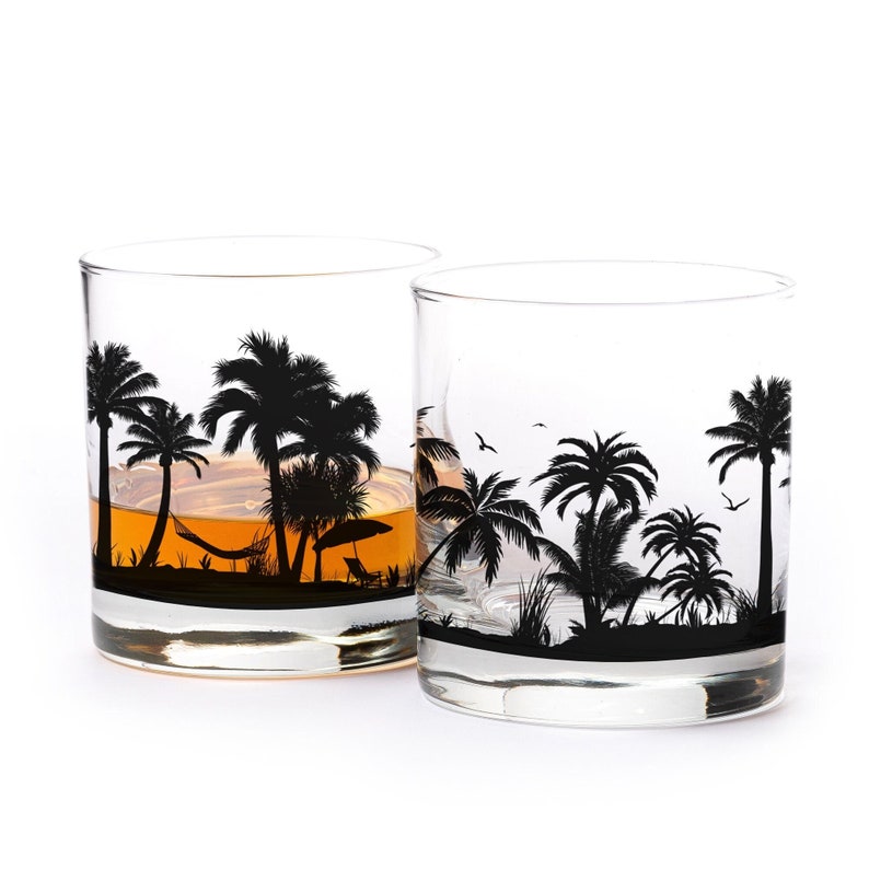 Beach whiskey glass set with palm trees and ocean landscape