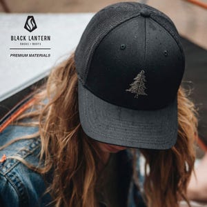Black baseball cap with mountain and sunset design