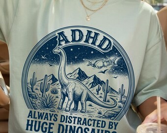 Funny Dinosaur ADHD PNG, Retro Dino Quote Design, Always Distracted By Huge Dinosaurs Shirt Graphic