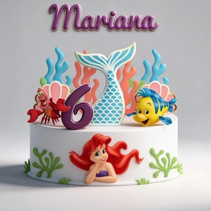 Pode incluir: Um bolo branco decorado com o tema sereia. O bolo apresenta uma cauda de sereia, o número 6 e personagens do filme, incluindo Ariel, Sebastião e Linguado. O nome "Mariana" está escrito em roxo acima do bolo.