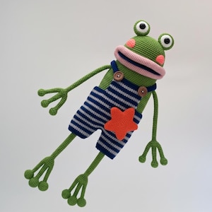 May include: A set of three ceramic mugs with a speckled, matte finish. The mugs are in shades of cream, light gray, and dark gray. Each mug has a simple, minimalist design, perfect for coffee or tea.