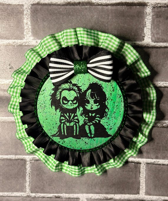 Laser-cut wood wall art of a gothic sweethearts couple — dark romance aesthetic done in miniature silhouette craft.