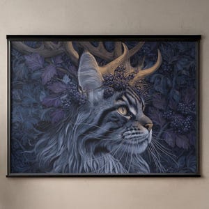 May include: A framed art print featuring a detailed illustration of a cat with antlers and a floral crown. The cat is depicted in profile, with a serene expression, set against a dark, leafy background. The artwork is displayed on a wooden desk.