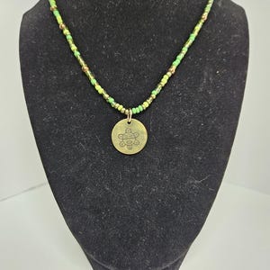 Sol Taino handkralenketting