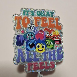 Inside Out &quot;It&#39;s Okay to Feel All the Feels&quot; retractable badge reel w/ accessories