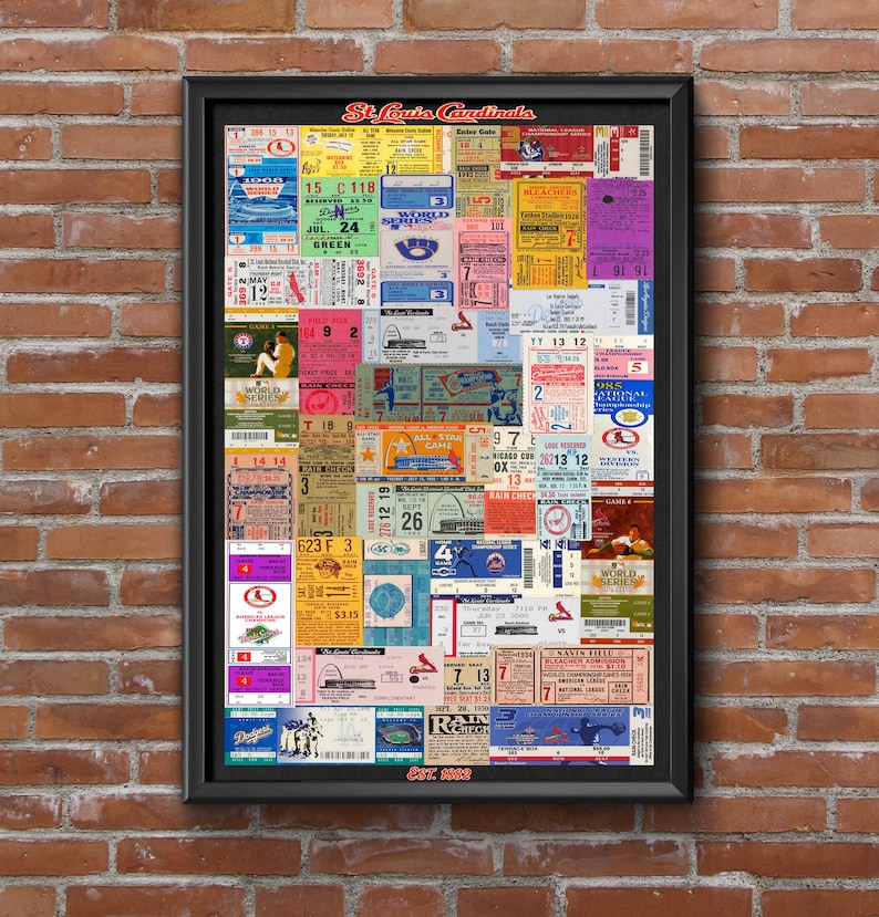 May include: A framed collage of vintage St. Louis Cardinals baseball tickets featuring various colors, dates, and game information. The text St. Louis Cardinals appears at the top, and Est. 1892 is printed at the bottom of the black rectangular frame.