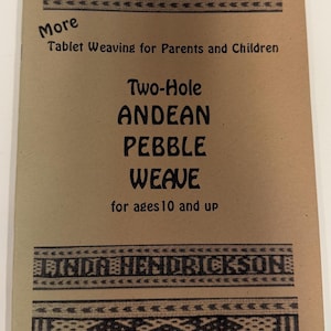 May include: A tan instructional booklet titled More Tablet Weaving for Parents and Children, Two-Hole ANDEAN PEBBLE WEAVE for ages 10 and up by LINDA HENDRICKSON. The cover features black printed text and decorative geometric border patterns.