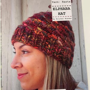 May include: A close-up of a knitted Elphaba hat in a variety of colours, including red, orange, and green. The hat is made with Rasta yarn and designed by Kristel Nieves. The word "malabrigo" is printed at the bottom of the image.