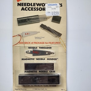 May include: Vintage Le Ran Needlework Accessory set. Includes a needle threader, magnetic needle minder, and magnetic needle case. The packaging features the Le Ran logo and product information, with the text "Needles & Thread not included."