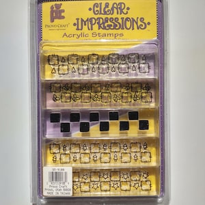 May include: Clear Impressions acrylic stamps set in a plastic package. The stamps feature various geometric and decorative shapes, including squares, stars, and other designs. The packaging includes the Provo Craft logo and the text "CLEAR IMPRESSIONS."