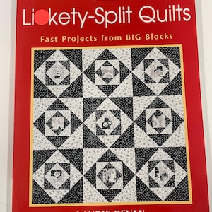 May include: A red book titled "Likety-Split Quilts" with the subtitle "Fast Projects from BIG Blocks." The cover features a quilt pattern in black, white, and gray, with a yellow border. The author's name, Laurie Bevan, is at the bottom.