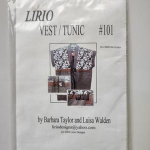 May include: A sewing pattern for a vest/tunic, titled "LIRIO VEST/TUNIC #101," is displayed in a clear plastic bag. The pattern includes multiple sizes and features a design with floral accents. The pattern is by Barbara Taylor and Luisa Walden.