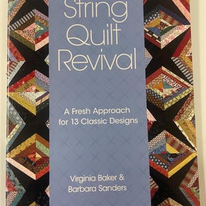 May include: A softcover book titled String Quilt Revival: A Fresh Approach for 13 Classic Designs by Virginia Baker and Barbara Sanders. The cover features a colorful patchwork quilt pattern on the sides and a light blue center panel with text.