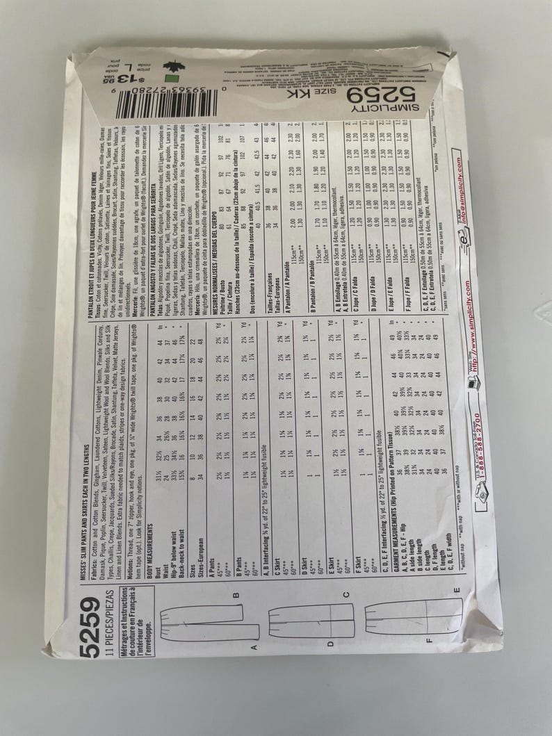 May include: A white Simplicity sewing pattern envelope for misses' slim pants and skirts, model 5259, size KK. The back of the envelope displays detailed fabric requirements, body measurements in centimetres, and technical line drawings of the garments.