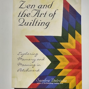 May include: A book titled "Zen and the Art of Quilting" with a colorful patchwork star design. The cover features text about exploring memory and meaning in patchwork, with the author's name, Sandra Detrixhe, at the bottom.