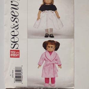 May include: A sewing pattern for doll clothes. The pattern features two doll outfits: a black and white dress and a pink robe with matching pants. The pattern includes the text "see & sew" and "YES! It's easy".