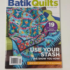 May include: Fons & Porter's Batik Quilts Winter 2016 magazine cover featuring a colorful blue, pink, and green patterned quilt. The text reads Batik Quilts, 19 Beautiful Batik Projects, Use Your Stash We Show You How, and Sew Easy Lessons For 6 techniques.