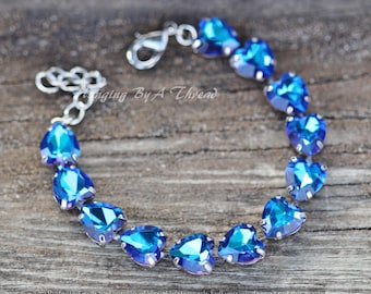 Bracelet Rétro Femme Avec Pampille En Forme De Cœur Et Dauphin - Couleur Argenté - Occasion En Bon état
