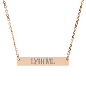 May include: Rose gold-colored necklace with a rectangular pendant. The pendant has the letters "LYHFML" engraved on it. The chain is delicate and links to the pendant on each side.