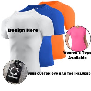 May include: A set of three short-sleeve athletic shirts in white, blue, and orange, each featuring raglan sleeves and a crew neckline. The white shirt displays the text Design Here. A black rectangular gym bag tag with the Moon Man logo is included.