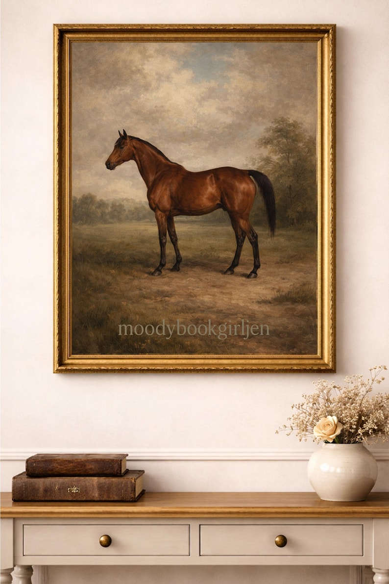 May include: A framed painting of a brown horse in a field. The horse is in profile, facing left, with a dark mane and tail. The artwork is in a gold frame and is displayed above a wooden table.