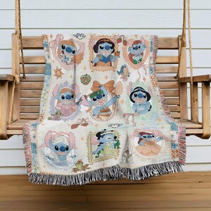 A colorful throw blanket featuring various characters from the Disney animated film "Stitch", including Lilo, Snow White, and other beloved characters.