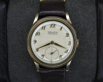 Reloj Gruen Precision Swiss de cuerda manual, con segundero pequeño y chapado en oro, de la década de 1950.