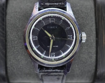 Reloj de pulsera Timex automático de cuerda automática para hombre, año 1959, esfera negra.