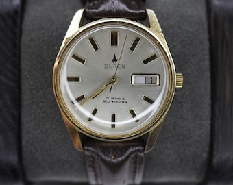 Reloj Buren automático vintage con fecha y día, 17 rubíes, suizo, 35 mm, serie 9345 9107/12D. Funciona.