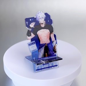 May include: A clear acrylic stand featuring a stylized anime character with white hair and a black top. The stand has a blue background with the name "PHAINON" and the text "ALL FOR PHAINON".