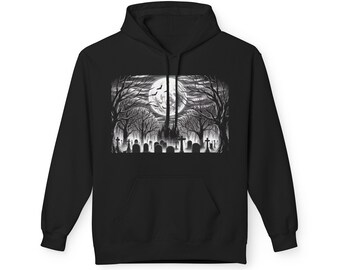 May include: Black hoodie with a grayscale graveyard scene print. The design depicts a full moon, bare trees, and tombstones, evoking a Halloween or gothic atmosphere. The sweatshirt has a front pocket and a hood, suitable for cooler weather.