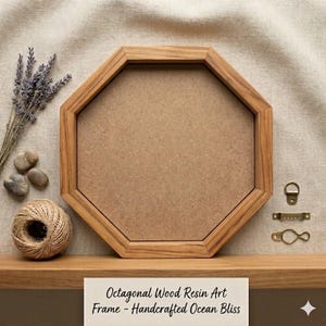 May include: Octagonal wooden art frame with a light brown finish. The frame has a neutral-colored backing and includes hanging hardware. The text on the bottom reads "Octagonal Wood Resin Art Frame - Handcrafted Ocean Bliss."