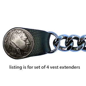 May include: A set of four black leather vest extenders with silver chain and a buffalo nickel design.  The nickel features the text "LIBERTY" and "1937".  Listing is for set of 4 vest extenders.