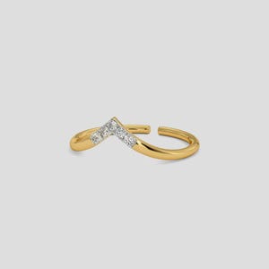 May include: A gold-colored ring with a V-shaped design. The ring features a row of small, clear gemstones set in the center of the V. The ring is open at the back, allowing for some size adjustment. The ring is set against a light gray background.