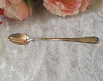 Ice cream spoon 7 3/8" with intricate pattern WM  A. Rogers Oneida LTD Silver Plated . Gift idea.