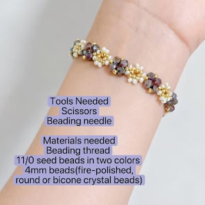 May include: A beaded bracelet with a mix of purple, gold, and white beads. The bracelet is made with 11/0 seed beads in two colors and 4mm crystal beads. The image also shows the tools and materials needed to make the bracelet, including scissors and beading thread.