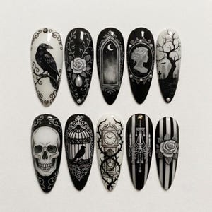 May include: A set of ten almond-shaped press-on nails featuring black and white gothic illustrations. Designs include a raven, a rose, an arched window, a cameo, a graveyard, a skull, a birdcage, a grandfather clock, a chandelier, and stripes.
