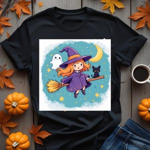 May include: Black t-shirt featuring a cartoon witch riding a broom with a black cat and a ghost. The design is set against a blue background with stars and a crescent moon. The shirt is surrounded by pumpkins and autumn leaves.